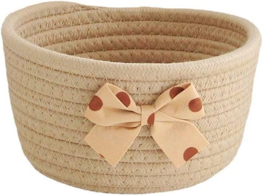 Ce panier a linge propose une partie textile en coton avec une poignee de prise en main